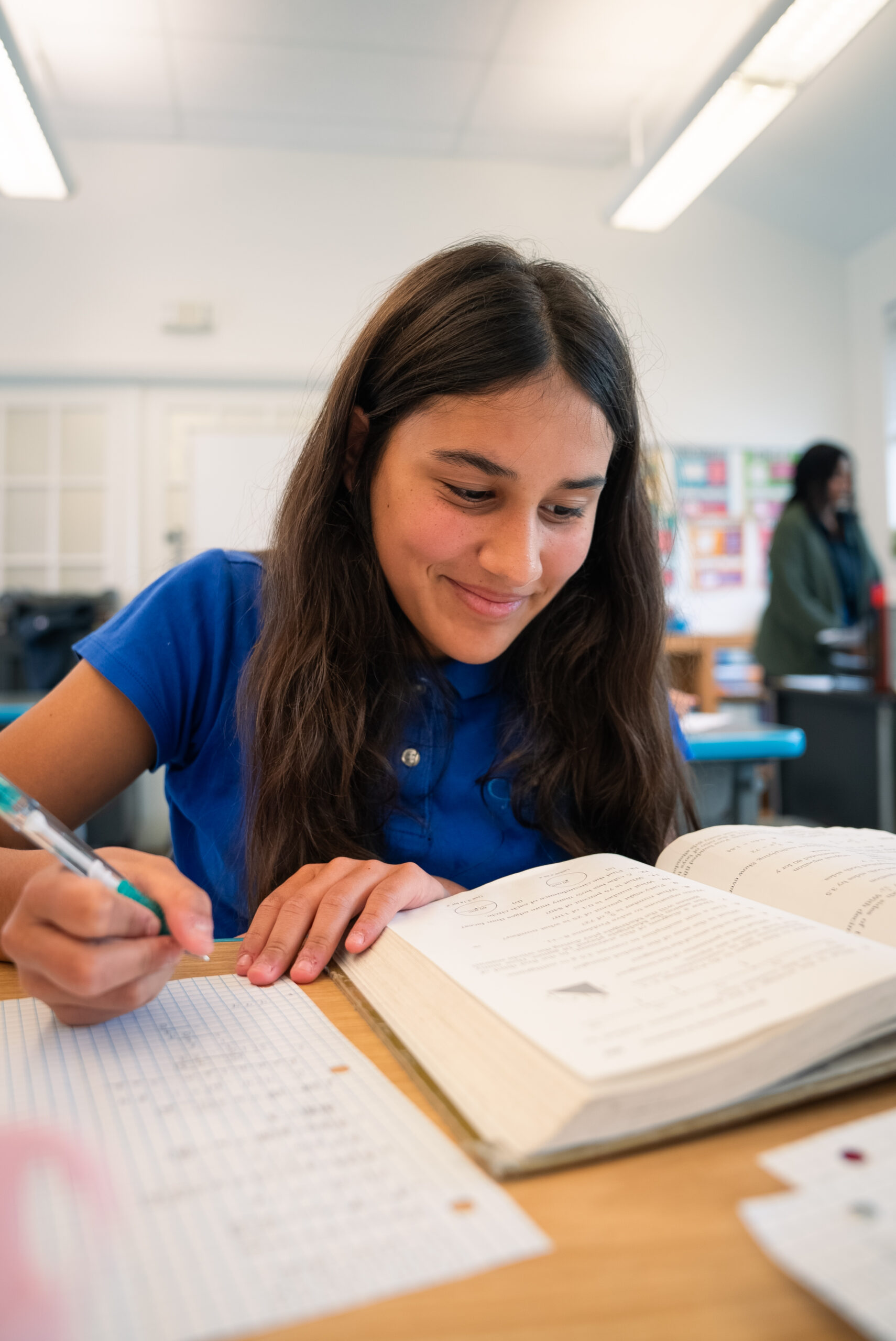 Clearwater Academy teacher working with a young student
